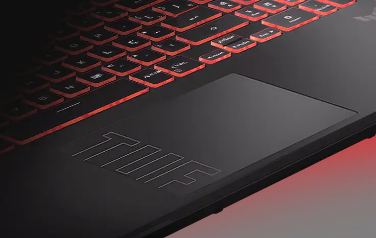 A close-up view of the TUF Gaming A16’s lower keyboard and trackpad, with the TUF logo clearly visible on the trackpad.
