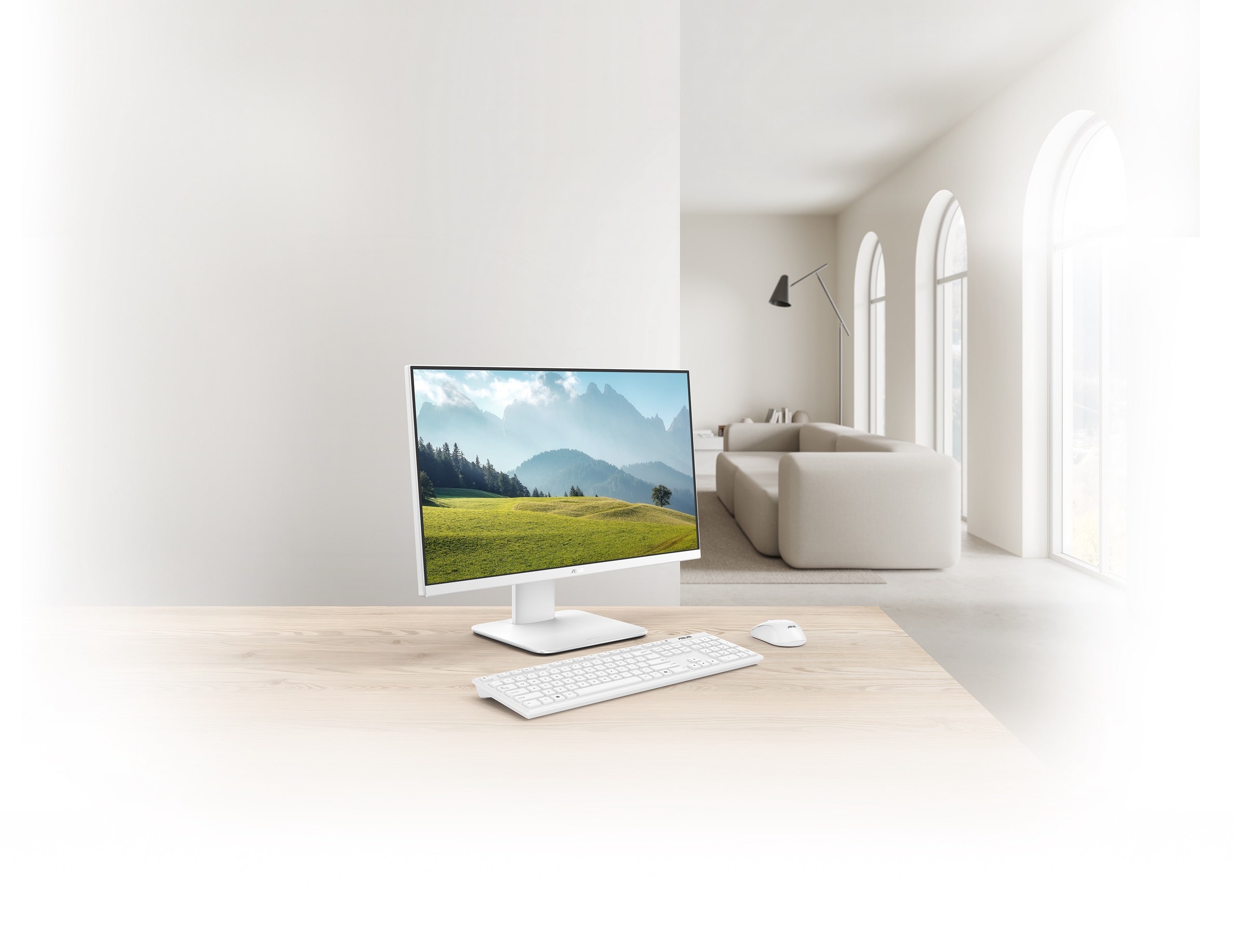 An ASUS V400 AiO, accompanied by a keyboard and mouse, is shown on the wooden desk with a living room in the background.