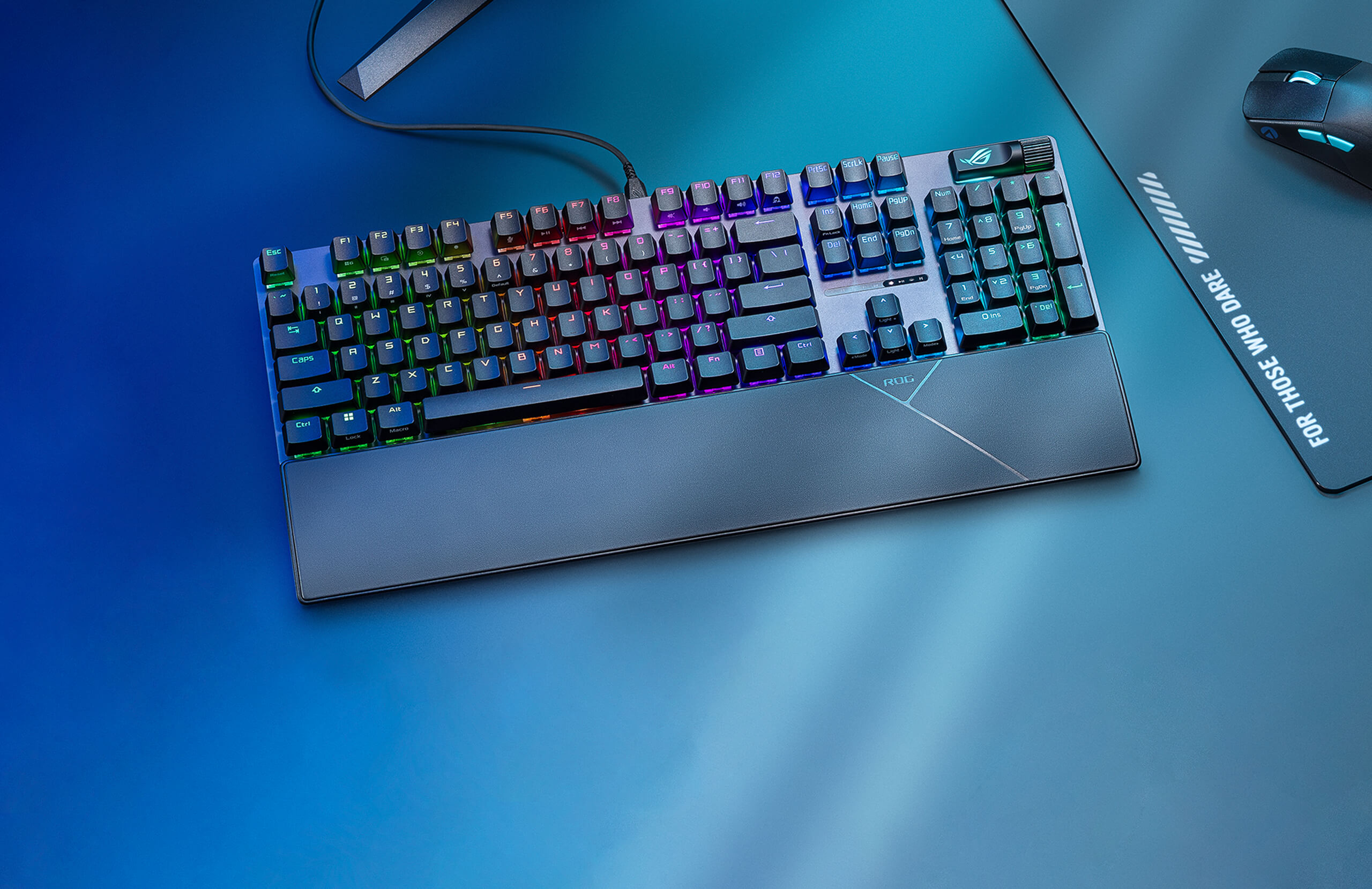 ROG Strix Scope II X on a table with some other ROG gaming peripherals