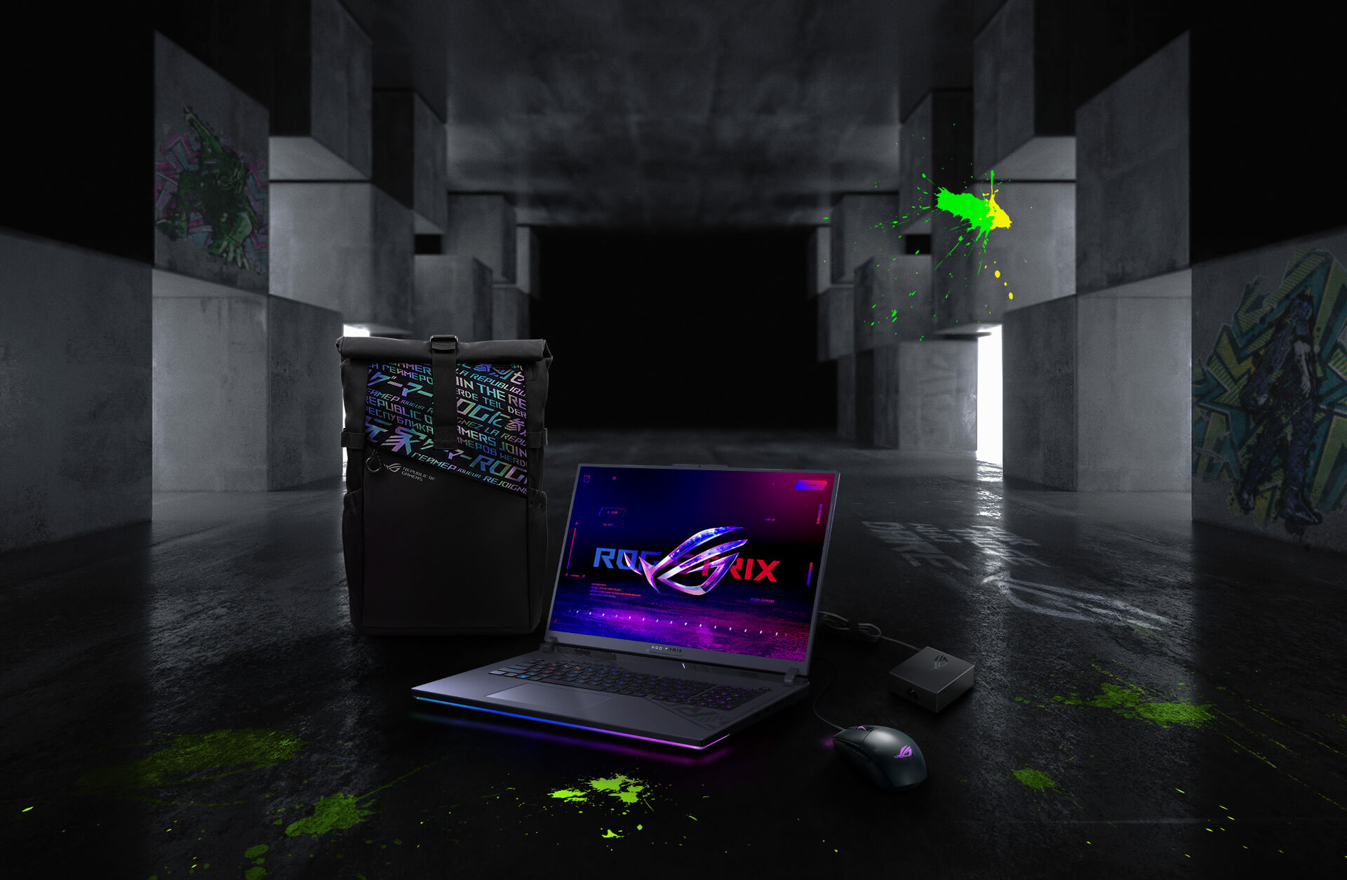 In an underground big space, from left to right; an ROG backpack, G18, ROG Strix Gladius III mouse, and 100W adapter.