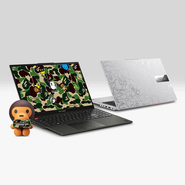 The banner shows two asus vivobook s 15 oled bape edition laptop including silver and black along with the baby milo figurine. Also, there logos including the collaboration logo, ASUS Lumina OLED logo and No.1 OLED logo at the right corner of the banner.