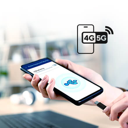 a hand connecting a smartphone to a router via a USB cable, with the screen showing a USB tethering icon.