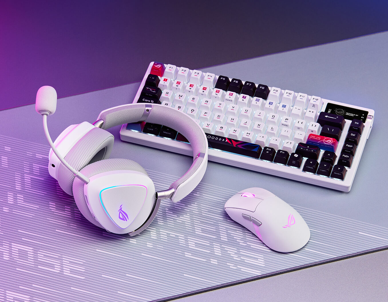 The ROG Delta II Moonlight White Edition, ROG Keris II Origin and ROG Azoth X both on ROG Scabbard II Arctic Gray XXL