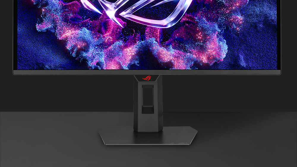 The front image of XG27AQDPG with a mobile phone on device groove
