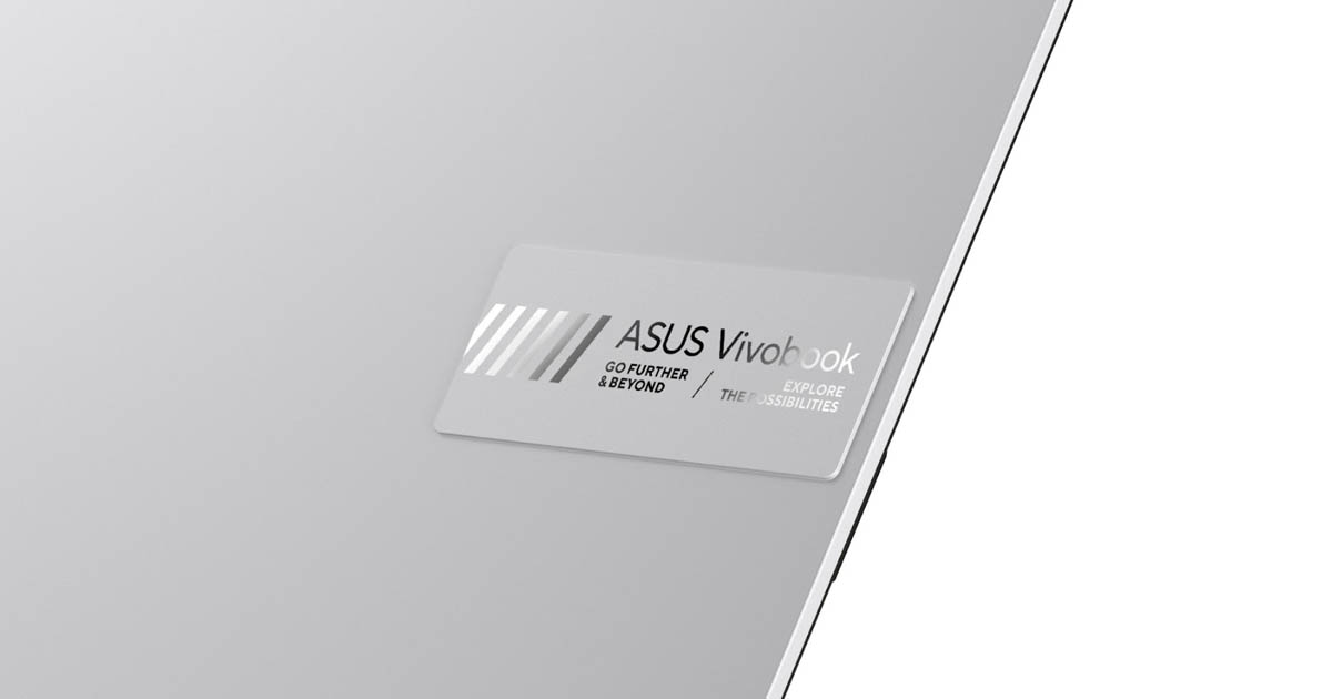 close shot of ASUS Vivobook raised logo tag on the Cool Silver colorway of ASUS Vivobook S 14/15 OLED laptop