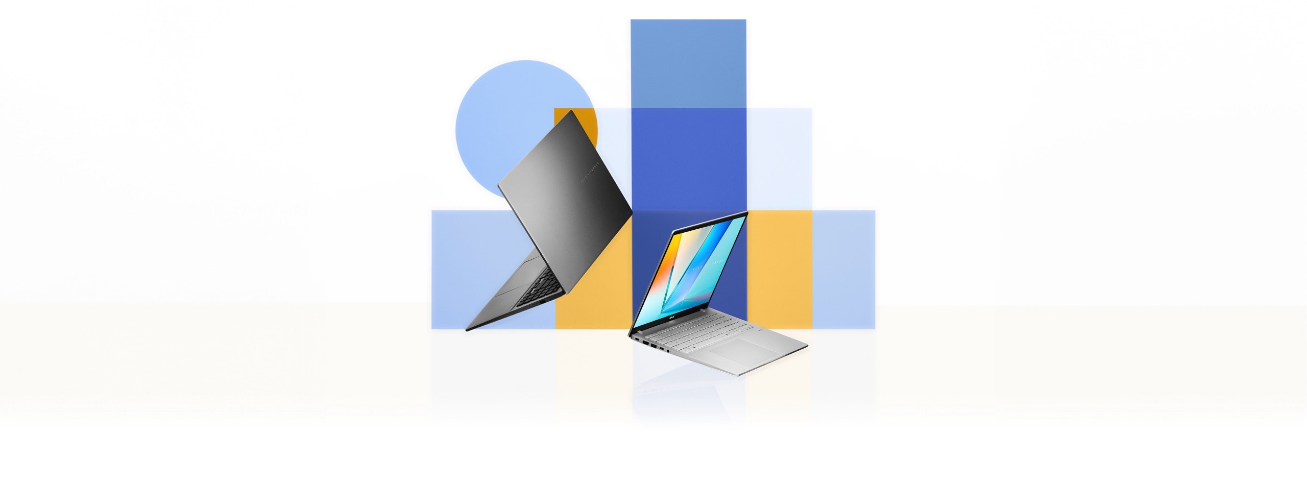 Two open laptops, one grey and one silver, appear angled in front of overlapping blue and yellow rectangular and circular shapes. 