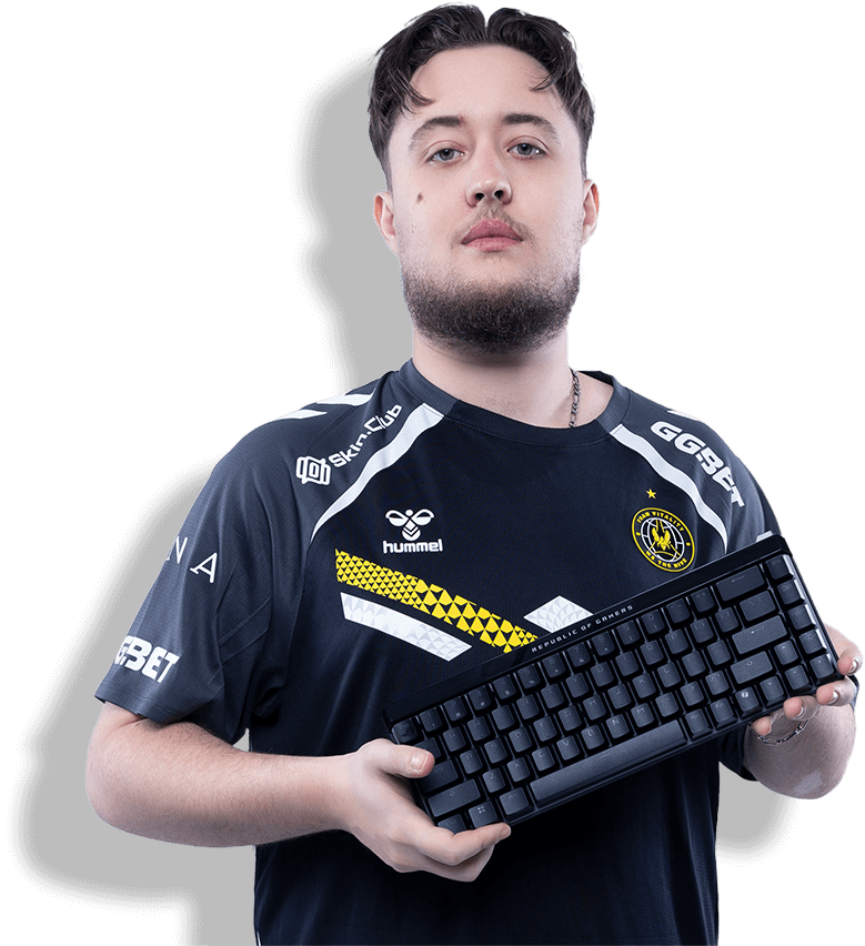 A frontal shot of CS2 champion ZywOo holding the Falchion Ace HFX esports magnetic keyboard