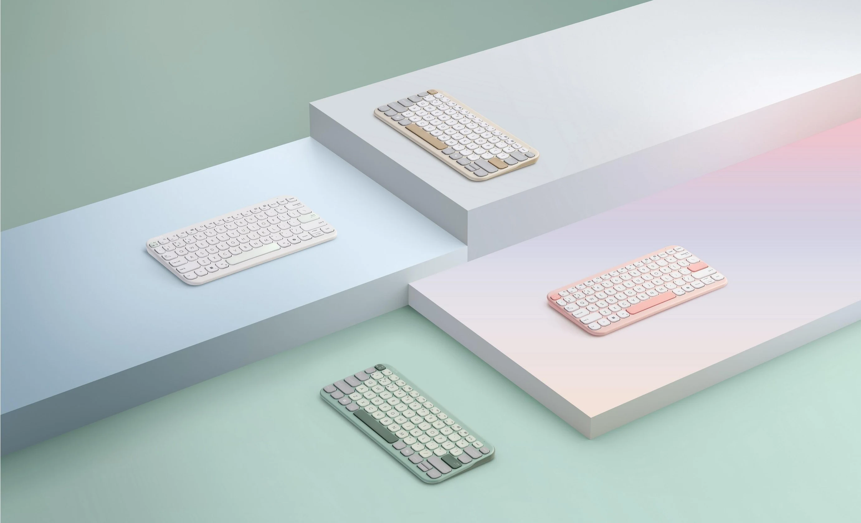 Four ASUS Marshmallow Keyboard KW100 shown side by side to show the different color schemes