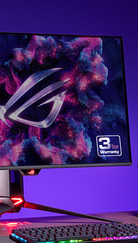 Monitor ROG OLED a klávesnice na stole.
