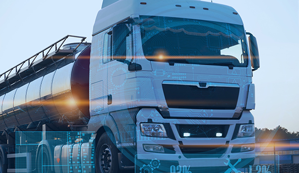 An autonomous truck driving on a road.