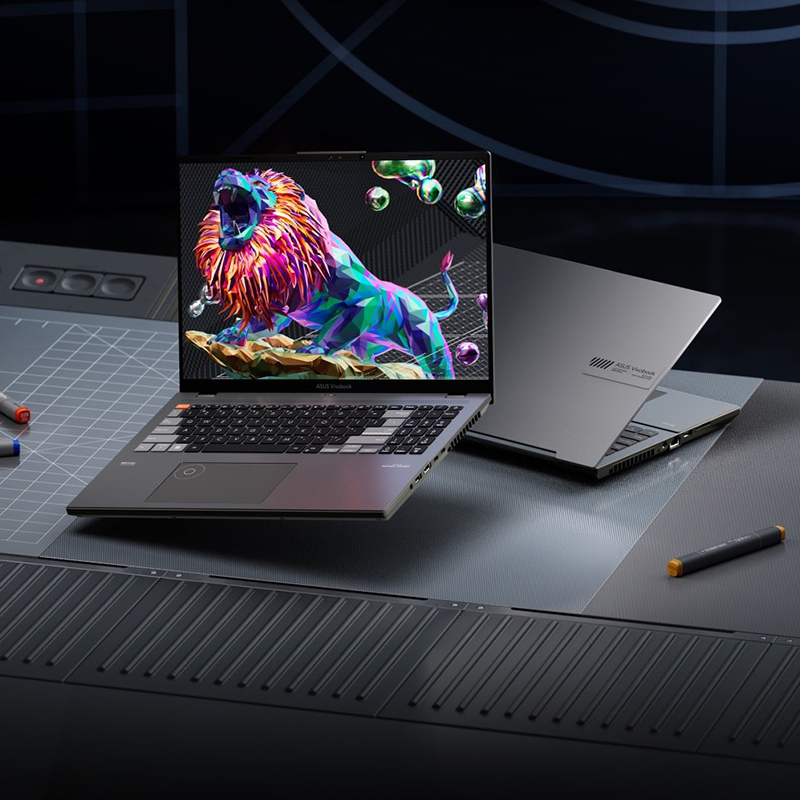 ASUS ProArt Studiobook 16 OLED creator laptop with a colorful background matching the modern background