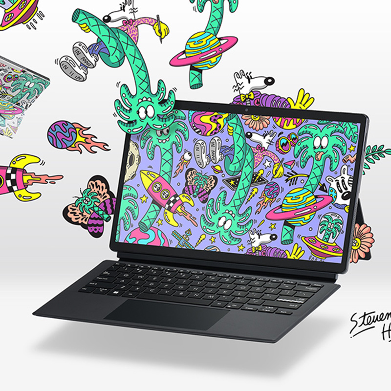 ASUS Vivobook 13 Slate OLED T3300 Steven Harrington edition 2-in-one laptop with detachable keyboard with colorful psychedelic art by Steven Harrington on the wallpaper and around the laptop and the artist’s signature next to the laptop
