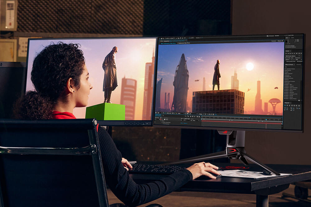 Woman editing a photo on a dual-monitor setup. 