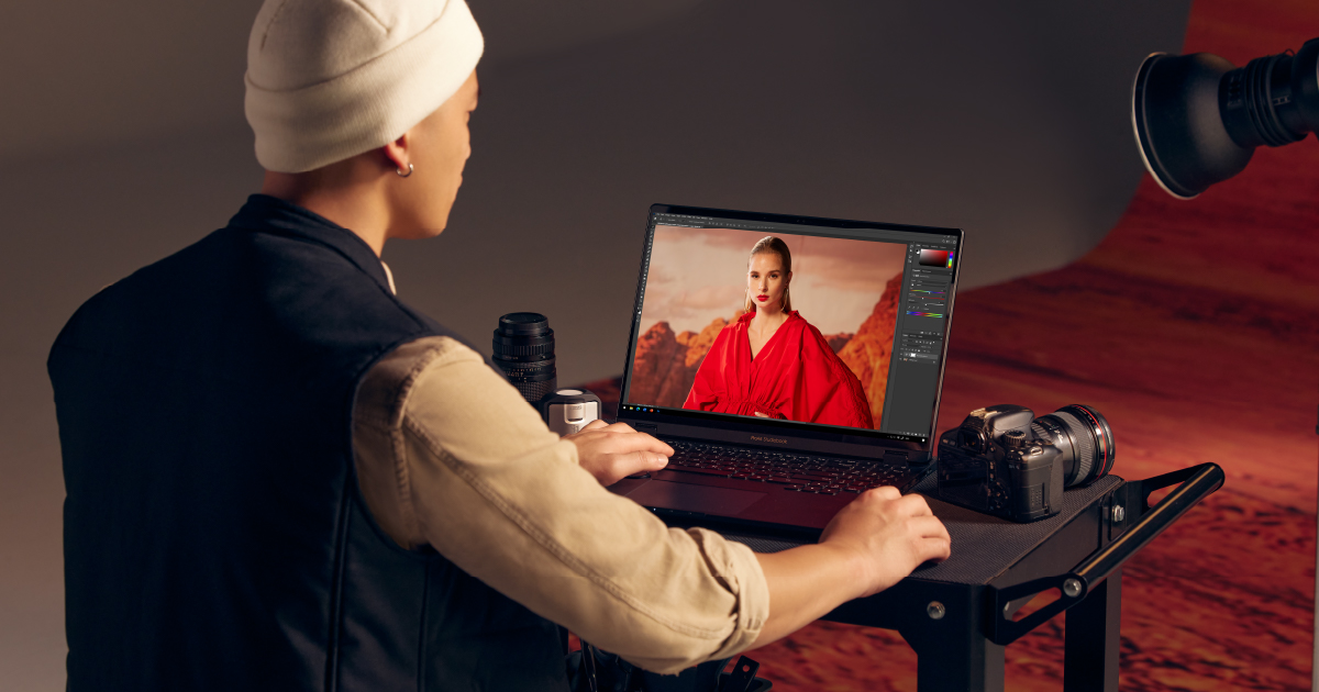 Graphic designer working on a color-specific design on a ProArt Studiobook 16 OLED 16-inch creator laptop