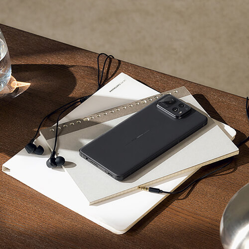 The picture of Zenfone 12 Ultra (Ebony Black) situated on a desk.