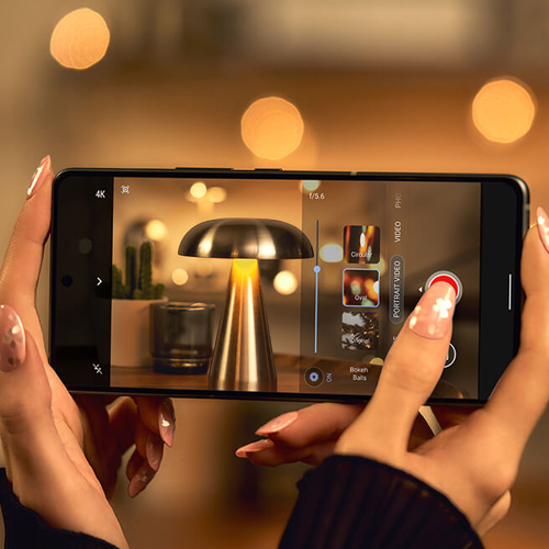 A woman recording a video using the AI Portrait Video mode on Zenfone 12 Ultra
