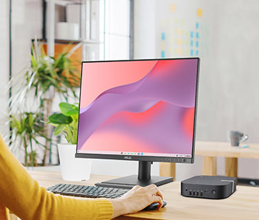 Moderní pracovní prostor s desktopem a monitorem ASUS zobrazujícím barevné abstraktní pozadí