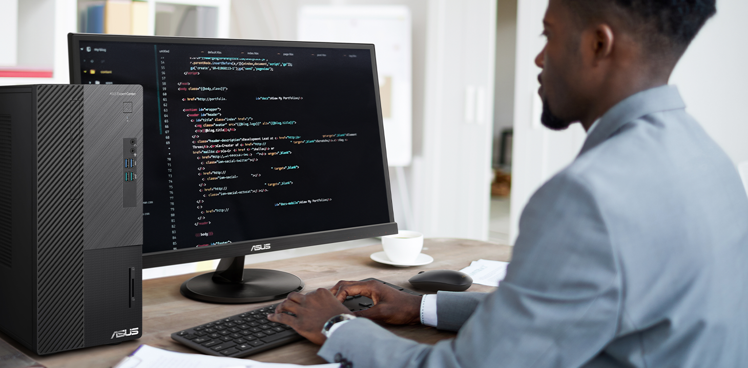 An IT sraff is working attentively by ASUS ExpertCenter D5 desktop.
