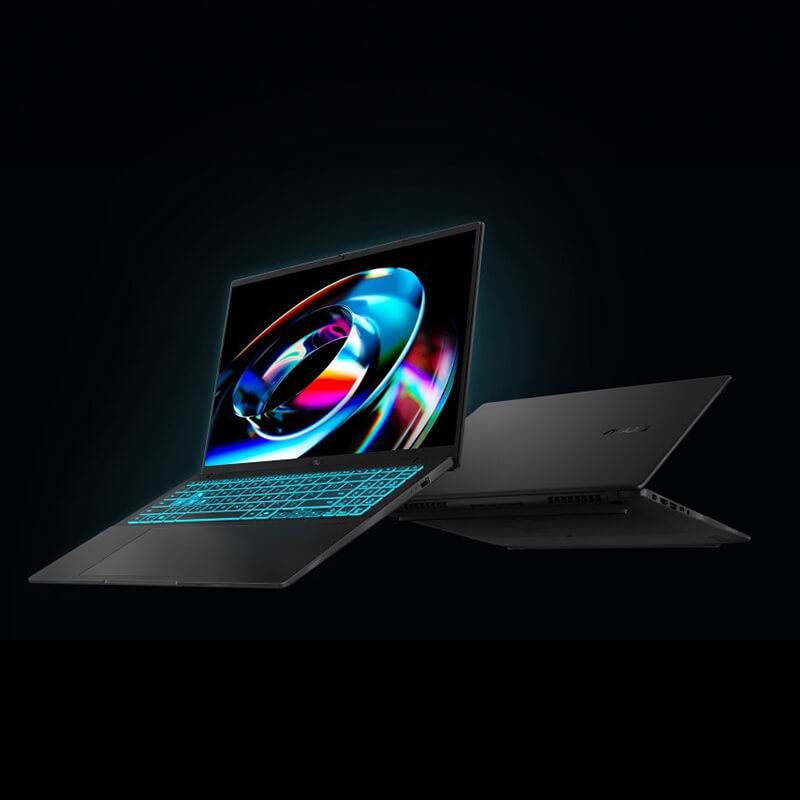 Two ASUS V16 laptops are placed back-to-back, with the one in the front open and showing a glowing keyboard and a futuristic image on the display.