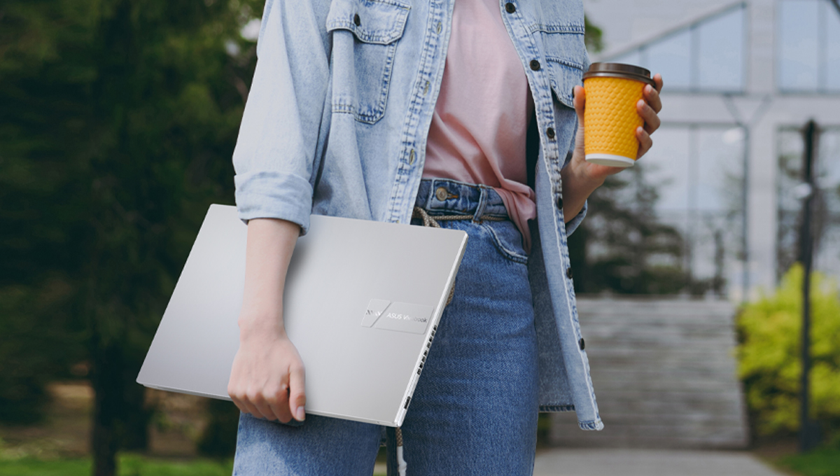 student carrying ASUS Vivobook 16 16-inch laptop