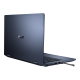 An angled rear view of an ASUS ExpertBook B3 Flip in laptop mode with a stylus half inserted in the garage.