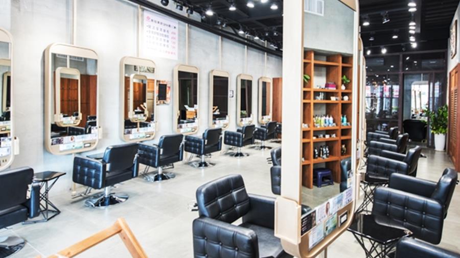 Modern salon with many seats and interactive smart mirrors 