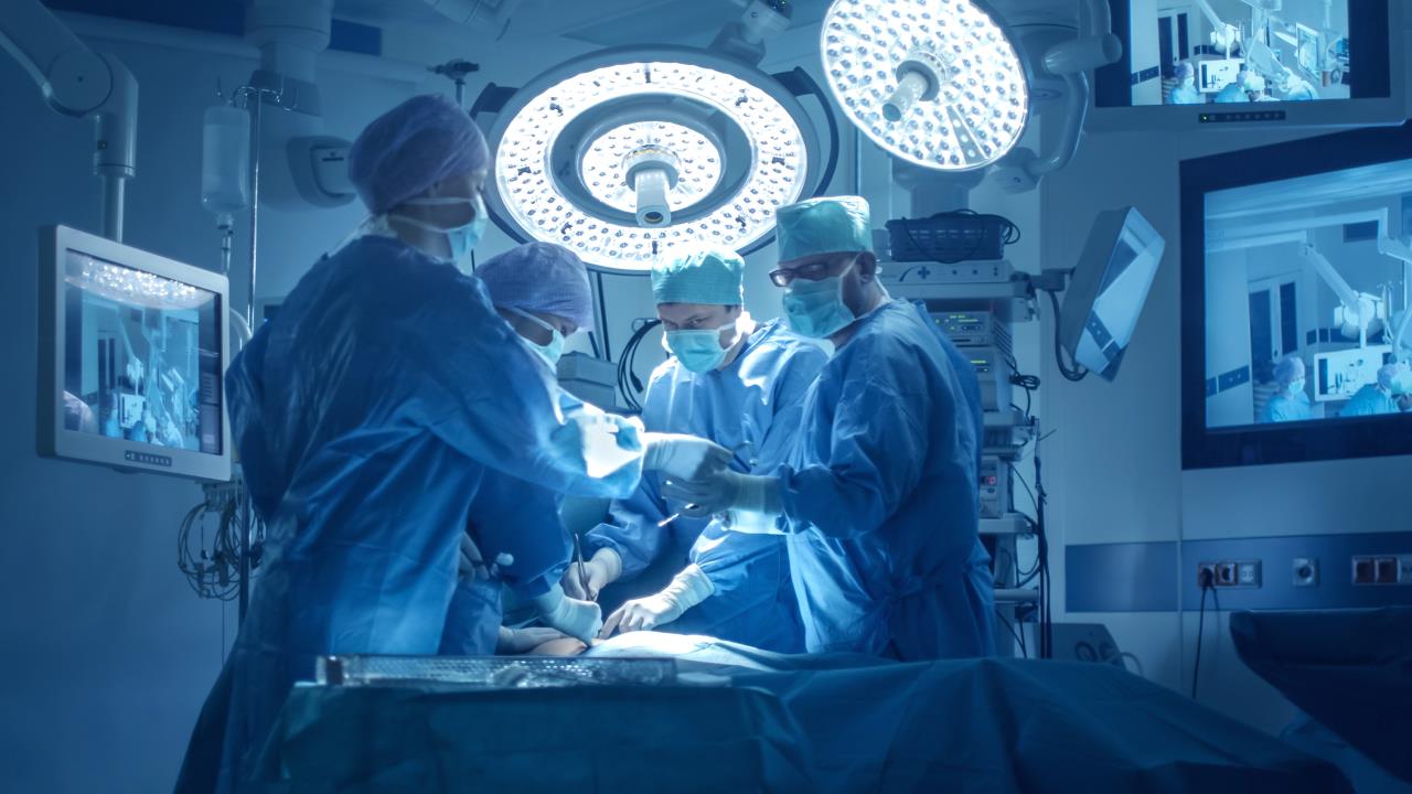 Medical team is doing surgery in modern operating room