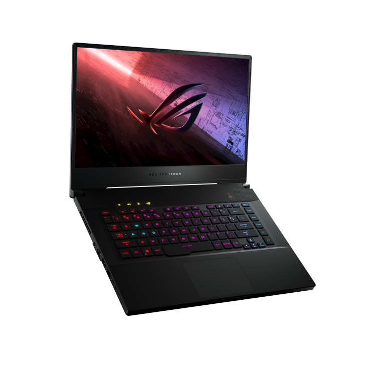 Off center front view of a Zephyrus S15 with the ROG logo on screen and the keyboard illuminated.