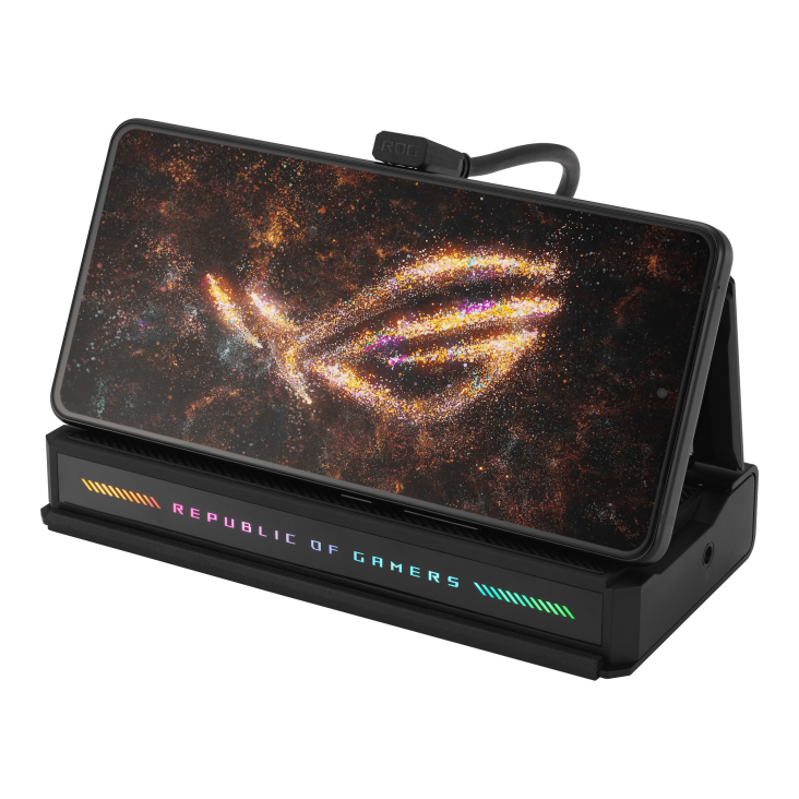 ROG Phone in a charging dock with a cosmic-themed wallpaper and Republic of Gamers lighting