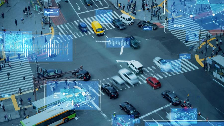 Aerial view of an intersection with four-way traffic, cars, and pedestrians, with data analyzed on the image.