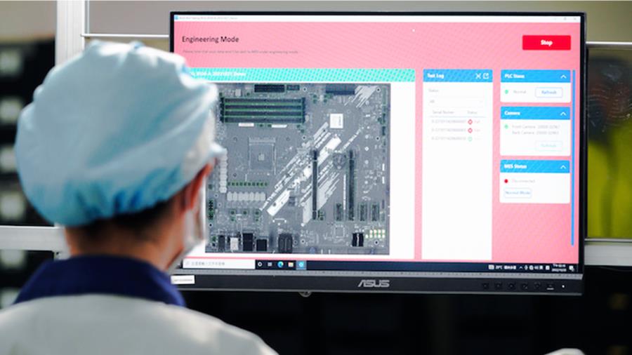 A female worker is sitting at production line doing product defect inspection