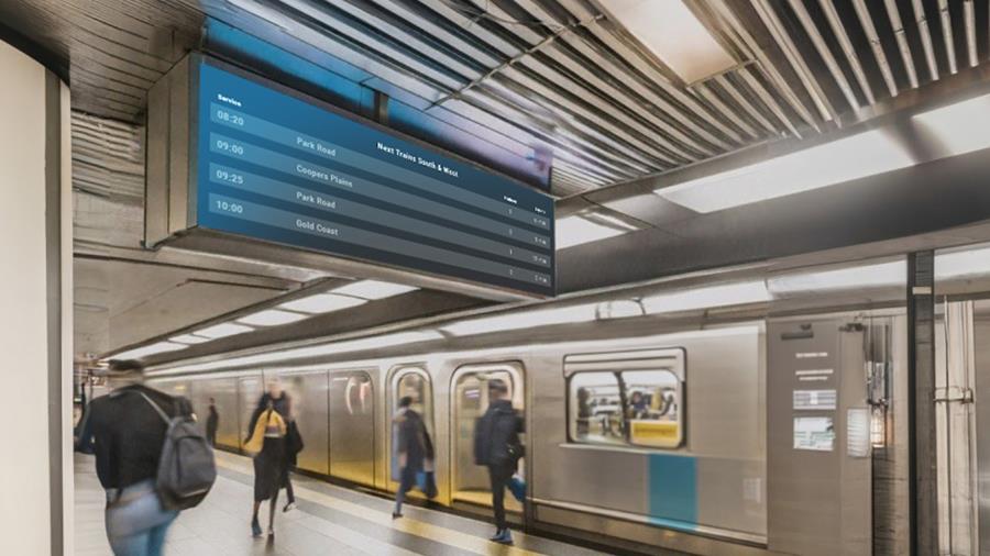 Digital signage at rail stations displaying information as passengers board and alight trains.