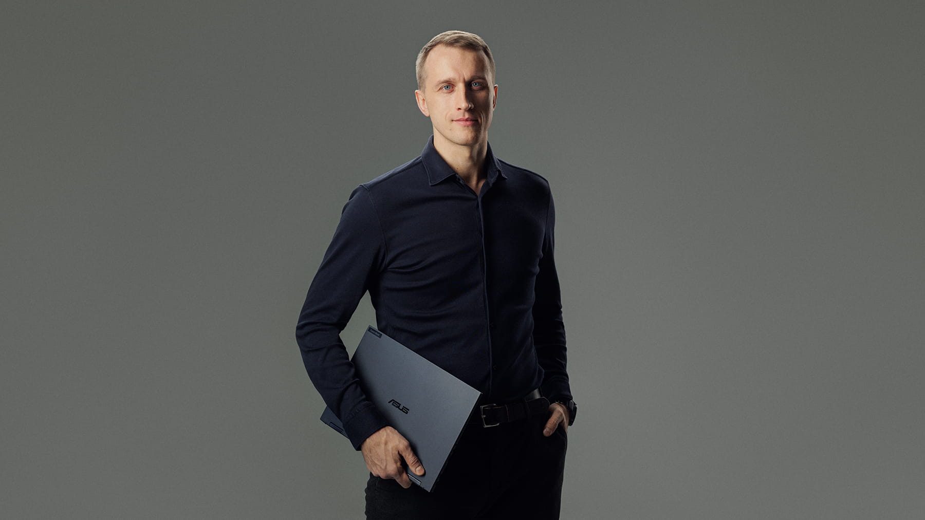 Rimas Kaminskas, ASUS commercial sales in Lithuania, holds ASUS ExpertBook