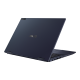 An angled rear view of an ASUS ExpertBook B7 Flip showing the Star Black chassis and glowing user status indicator.