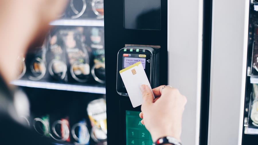 Customer using a smart vending machine with a interactive signage